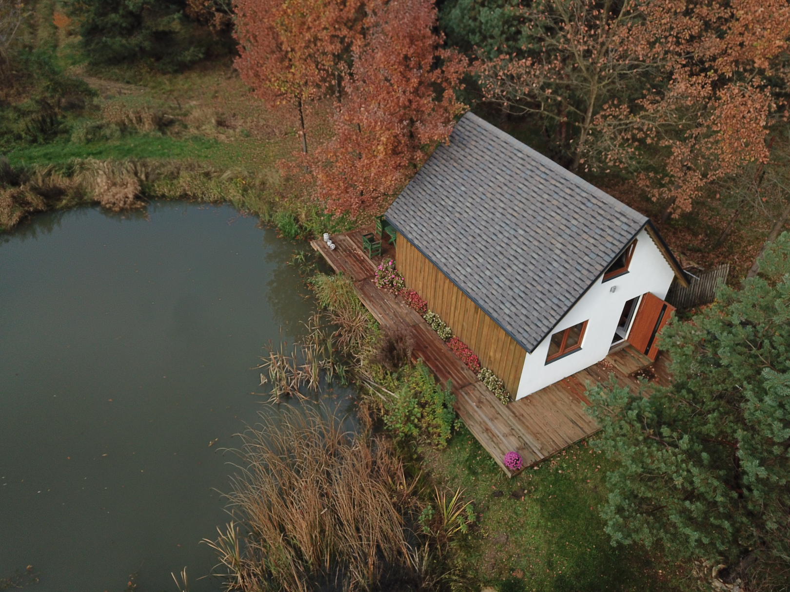 High-end modular home integrated seamlessly with a lush natural forest environment